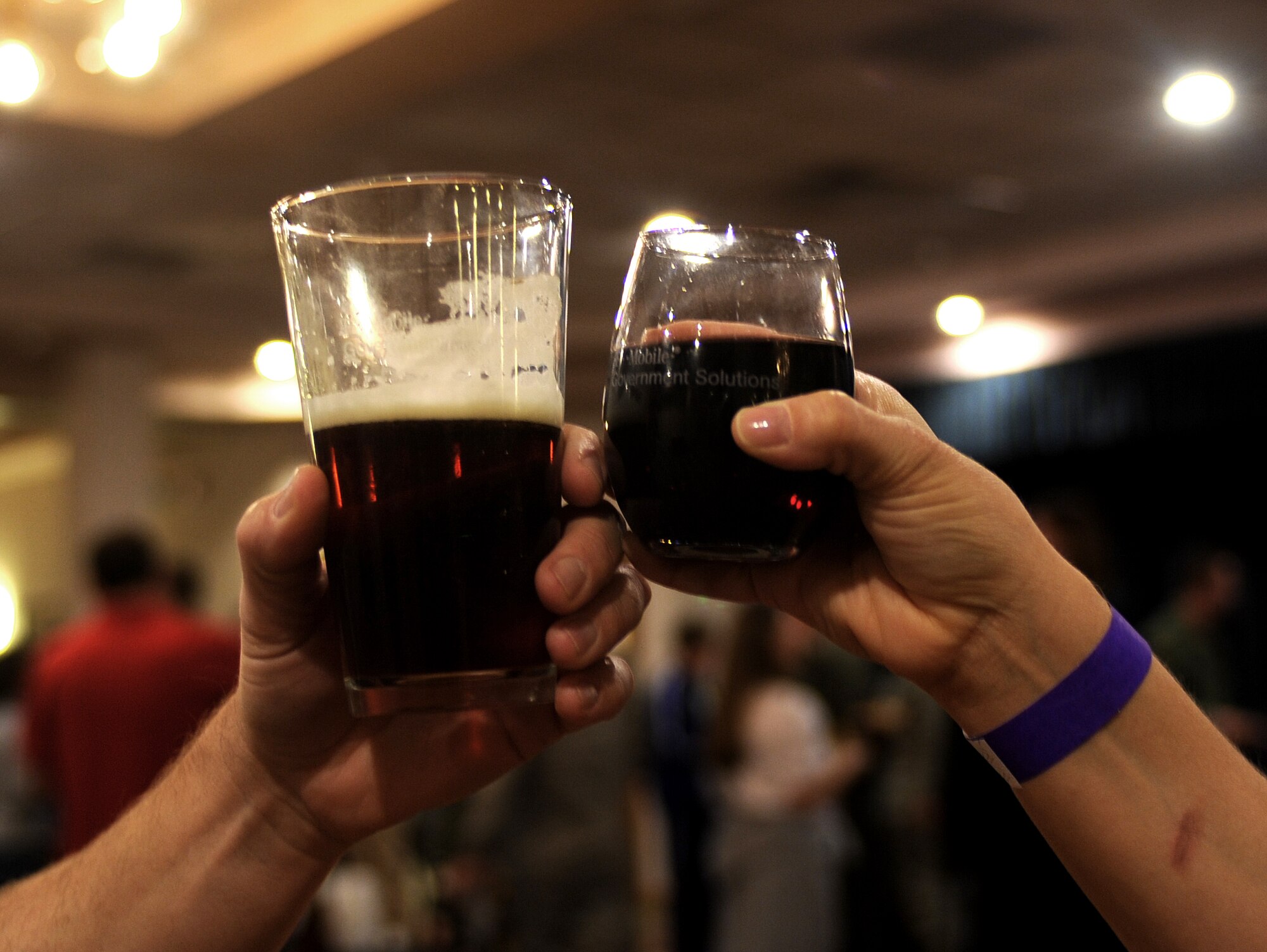 Two Air Commandos raise their glasses during the Raise Your Glass event that was held at the Landing Zone at Cannon Air Force Base, N.M., Nov.2, 2012. The event was open to active duty military, veterans and dependents of age to sample a variety of wine and beer. (U.S. Air Force photo/Airman 1st Class Xavier Lockley)