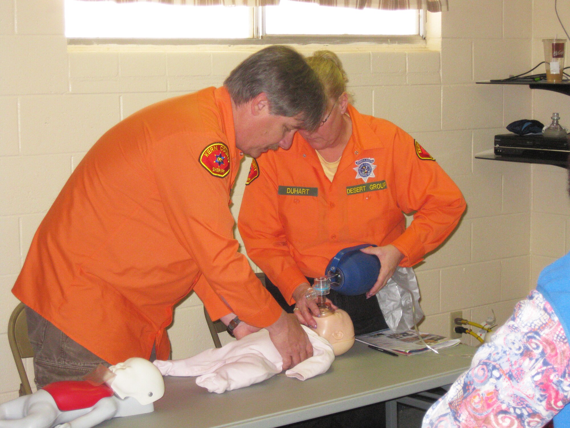 Brian Duhart, 412th Test Wing, and member of the Kern Country Sheriff's Department Desert Search and Rescue Team, practices first aid on a simulated child.  The team specializes in desert tracking techniques and advanced medical rescue. (Courtesy photo)