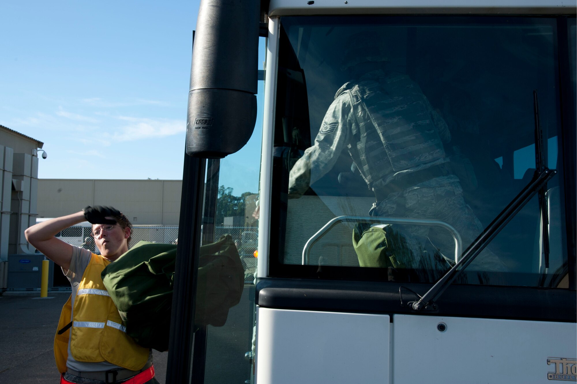 VANDENBERG AIR FORCE BASE, Calif. – Staff Sgt. Kristin Culbertson, 30th Logistics Readiness Squadron deployment operations non-commissioned officer-in-charge, helps unload a bus at the Installation Deployment Readiness Center for a Personnel Deployment Fuction line here Friday, Nov. 02, 2012. The line is a way for Airmen to ensure that they have everything they need and are cleared to deploy. (U.S. Air Force photo/Senior Airman Lael Huss)