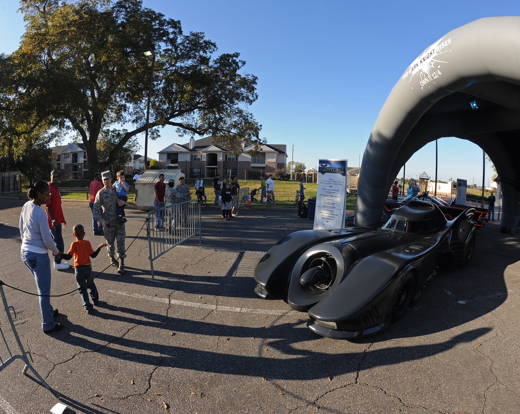 Members of Team Barksdale look at Batmobiles on display at the Barksdale Club parking lot on Barksdale Air Force Base, La., Oct. 30. Six Batmobiles and the Bat-Pod were brought to the base for Team Barksdale to enjoy. (U.S. Air Force photo/Senior Airman Micaiah Anthony)(RELEASED)
