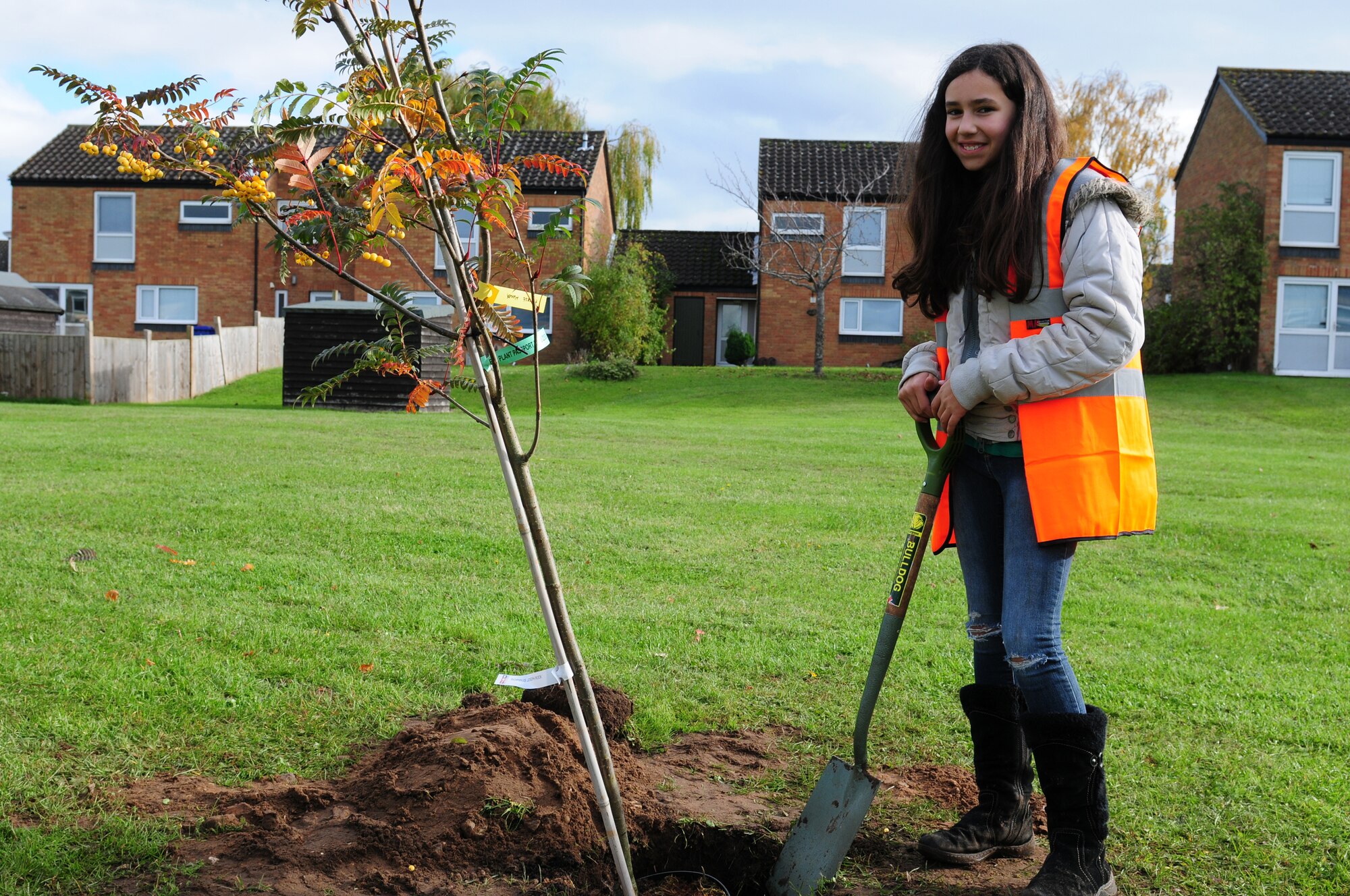 ROYAL AIR FORCE LAKENHEATH, England – Jasmine Clark, daughter of Tech. Sgt. James Clark, 48th Medical Surgical Squadron medical technician, plants a tree donated by the U.K.’s Forest Heath District Council after a Lord’s Walk base housing clean up Nov. 3, 2012. Clark recently had her 10th birthday and instead of asking for material gifts, she asked to help clean up her community. Residents of Lord’s Walk came out to clean up litter around their neighborhood, and the Forest Heath District Council assisted, as well as donated two trees for children to plant.  (U.S. Air Force photo by Airman 1st Class Cory D. Payne)