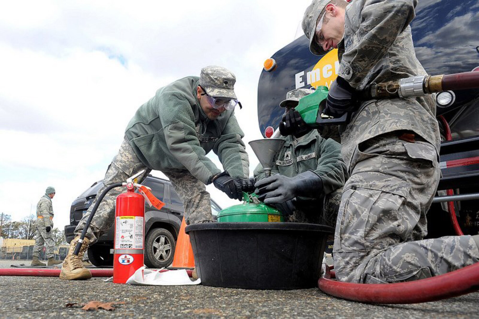 Soldiers and Airmen with the New York National Guard distribute fuel at the Staten Island Armory, Staten Island, N.Y., Saturday, Nov. 3, 2012, to those in the local area affected by Hurricane Sandy. The fuel was provided by the Federal Emergency Management Agency and distributed at various armories throughout the New York and northern New Jersey areas.