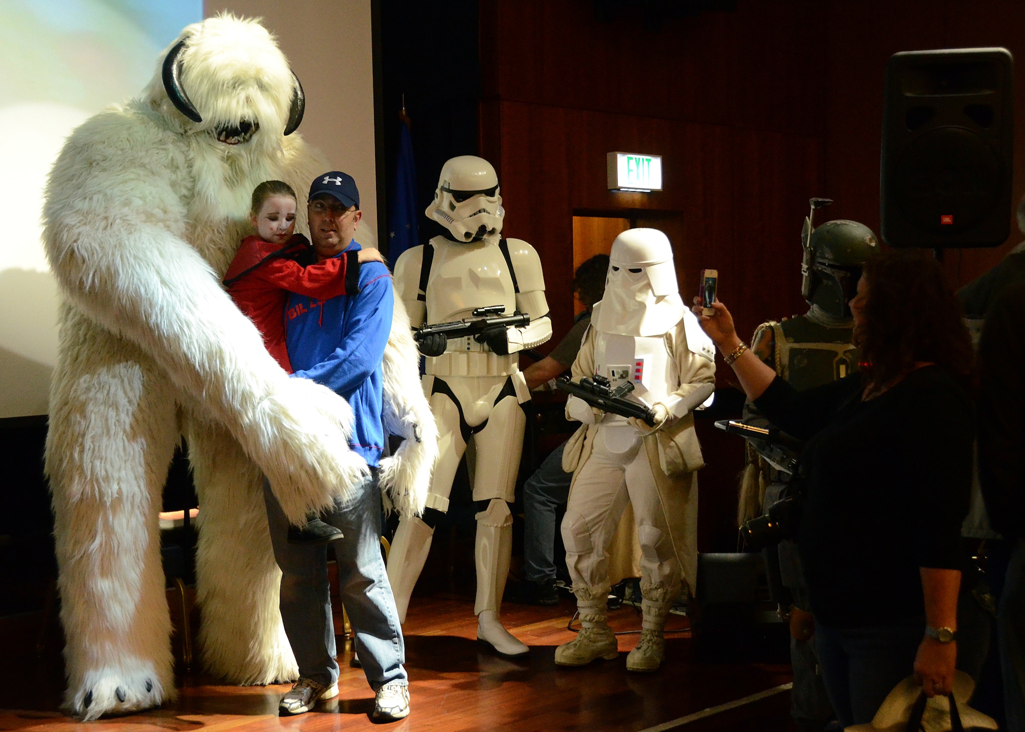SPANGDAHLEM AIR BASE, Germany – U.S. Air Force Master Sgt. Keith Lux, 52nd Medical Support Squadron and native of Buffalo, N.Y., poses with his daughter, Cameron, in front of an 11-foot wampa, or ice yeti from the Star Wars universe, during the Spangdahlem Science Fiction Convention Nov. 3, 2012. The wampa made an appearance as part of the 501st Legion, an organization that promotes interest in Star Wars through costumed charity and volunteer work. (U.S. Air Force photo by Staff Sgt. Daryl Knee/Released)