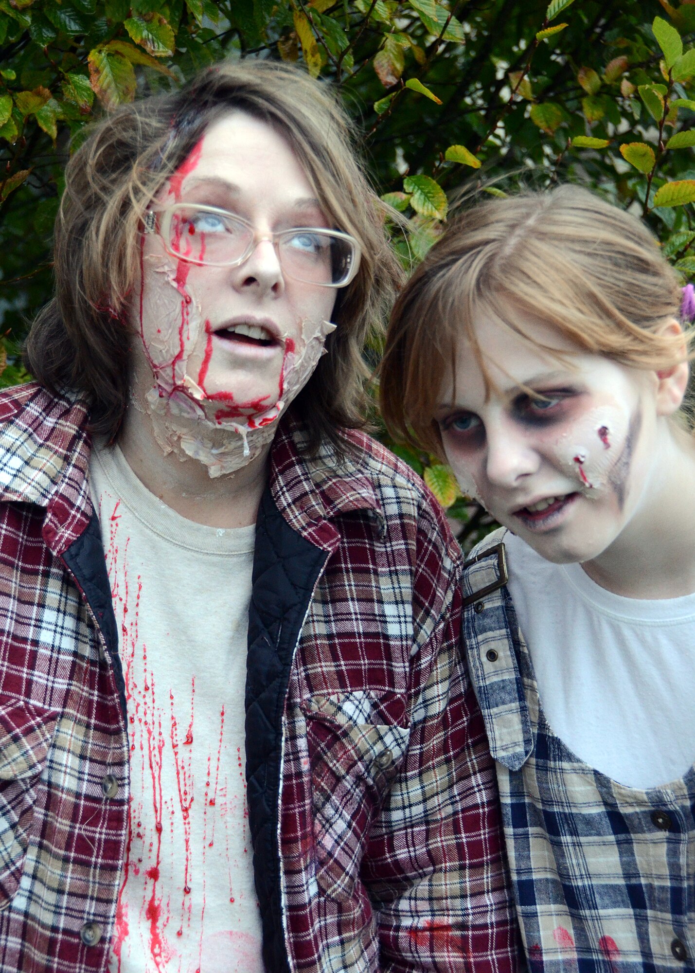 SPANGDAHLEM AIR BASE, Germany – Sandy Weeks, U.S. Army Garrison Benelux, Belgium, and native of Jacksonville, Fla., and her daughter, Rebekah, practice their facial expressions for the Spangdahlem Science Fiction Convention zombie run Nov. 3, 2012. SciFi Con coordinators canceled the run due to inclement weather, but the Weeks’ still won the best-dressed-zombie prize — a cookie jar shaped as a zombie head. Next year’s convention is tentatively slated for Nov. 3, 2013. (U.S. Air Force photo by Staff Sgt. Daryl Knee/Released)