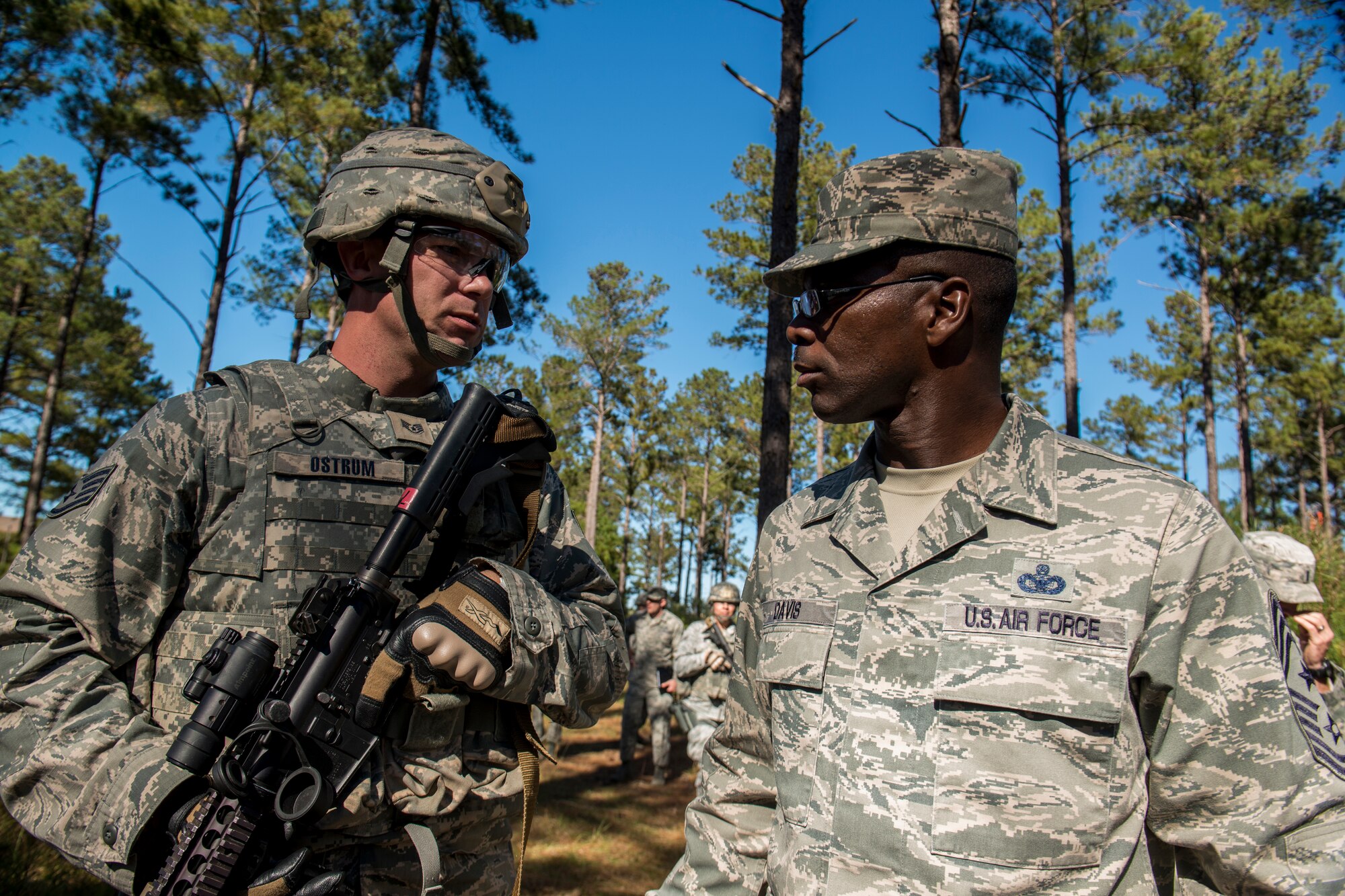 U.S. Air Force Joseph Ostrum, 823d Base Defense Squadron alpha squad leader, speaks with Chief Master Sgt. James Davis, 9th Air Force command chief, during improvised explosive device lane training at Moody Air Force Base, Ga., Nov. 1, 2012. Before taking on his new position, Davis served in the security forces career field for 22 years. (U.S. Air Force photo by Staff Sgt. Jamal D. Sutter/Released)    