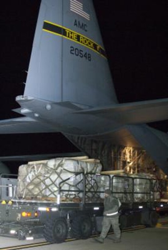 West Virginia Air National Guard members assigned to the 167th Airlift Wing load pallets of blankets destined for use by Hurricane Sandy victims onto a C-130 cargo aircraft at Shepherd Field Air National Guard Base in Martinsburg, W.Va., Nov. 3, 2012. A total of 25,000 blankets were flown from the base to John F. Kennedy Airport in New York.  (West Virginia Air National Guard photo by 2nd Lt. Stacy Gault)  
