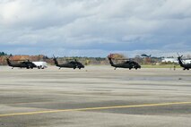 HANSCOM AIR FORCE BASE, Mass. – Four UH-60 Blackhawks from the 10th Mountain Division Combat Aviation Brigade are parked on the flightline Oct. 31. The brigade is at Hanscom as part of the USNORTHCOM Defense Support of Civil Authorities mission that directs the command to plan and anticipate action that it may need to take to support civil authorities. USNORTHCOM plays an important role in disaster response; however, all efforts for Hurricane Sandy are in support of FEMA, working closely with state and local officials. (U.S. Air Force photo by Mark Herlihy)