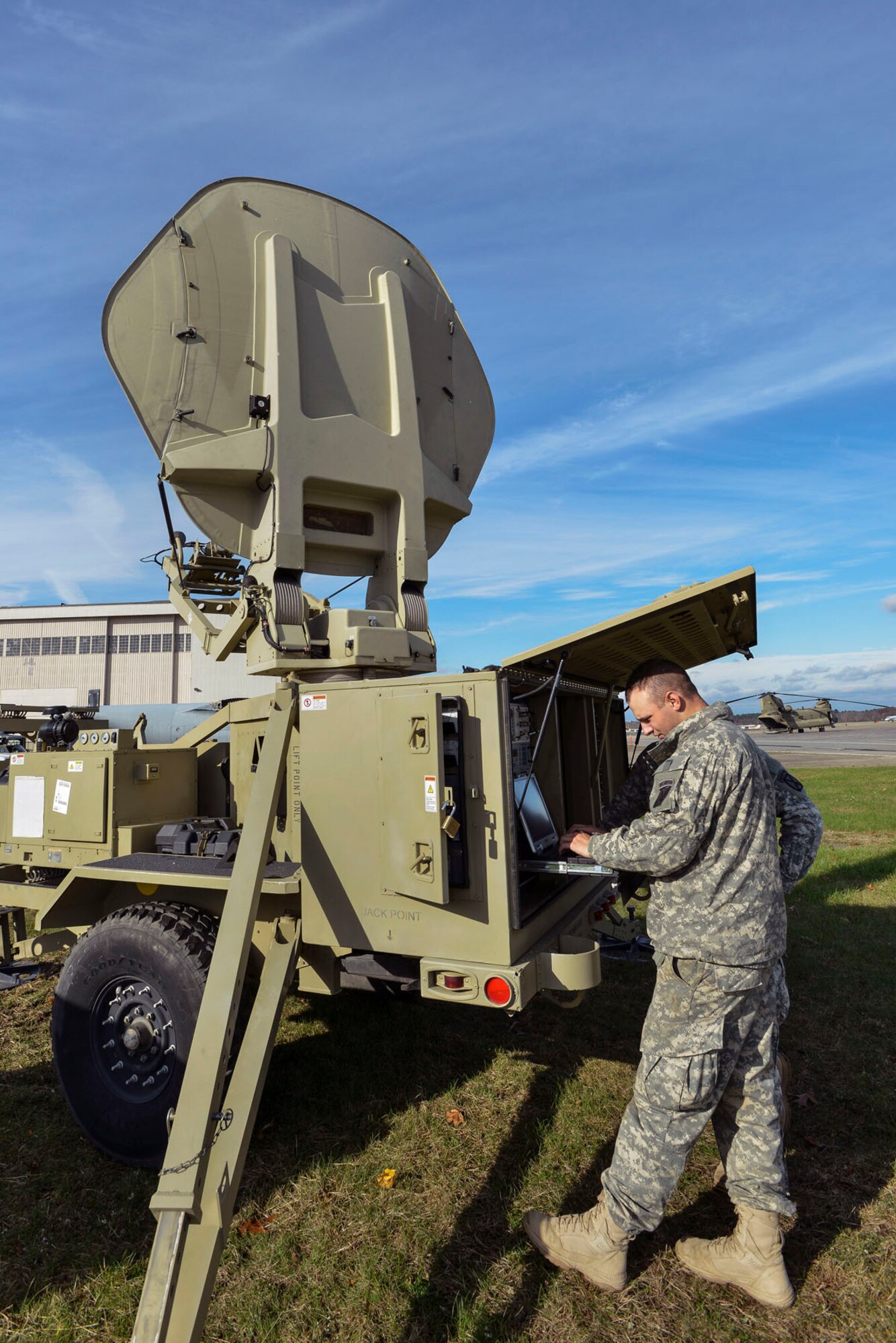 HANSCOM AIR FORCE BASE, Mass. – Spc. Gregory L. Kindall, an information technology specialist with Task Force Phoenix of Fort Drum, N.Y., initiates satellite communications for the unit’s tactical operations center Nov. 1. Kindall and his unit were at Hanscom in support of disaster response efforts for Hurricane Sandy. (U.S. Air Force photo by Walter Santos)