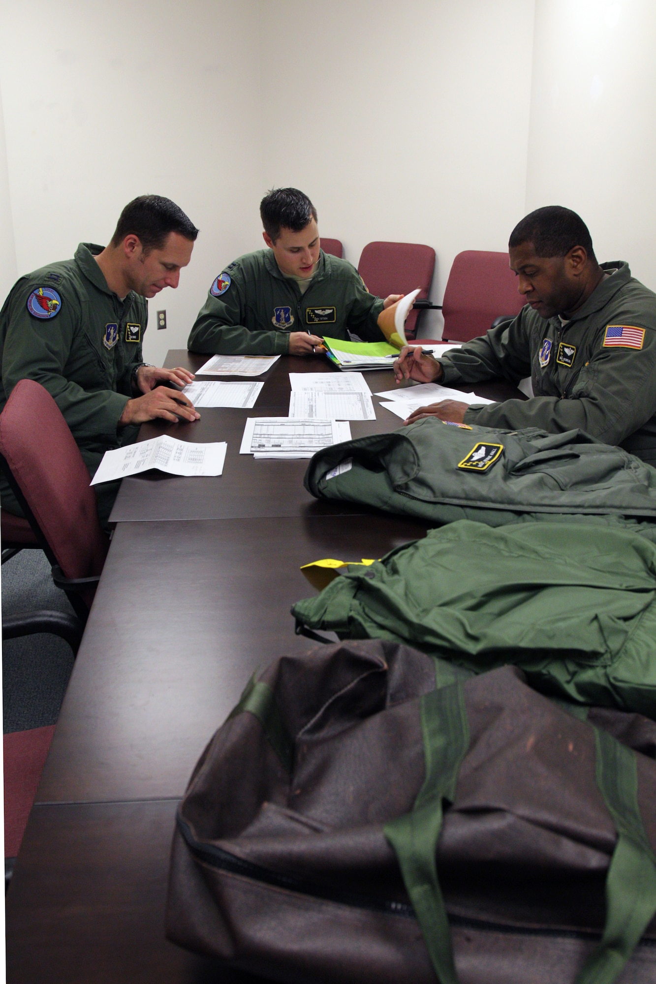 Air crew members from the 171st Air Refueling Squadron review their mission plan prior to a flight on a KC-135 Stratotanker at Selfridge Air National Guard Base, Mich., Nov. 4, 2012. The KC-135’s primary mission is to serve as an air-to-air refueling platform and typically flies with a three-person crew, two pilots and a refueling boom operator. (Air National Guard photo by SSgt. Rachel Barton)