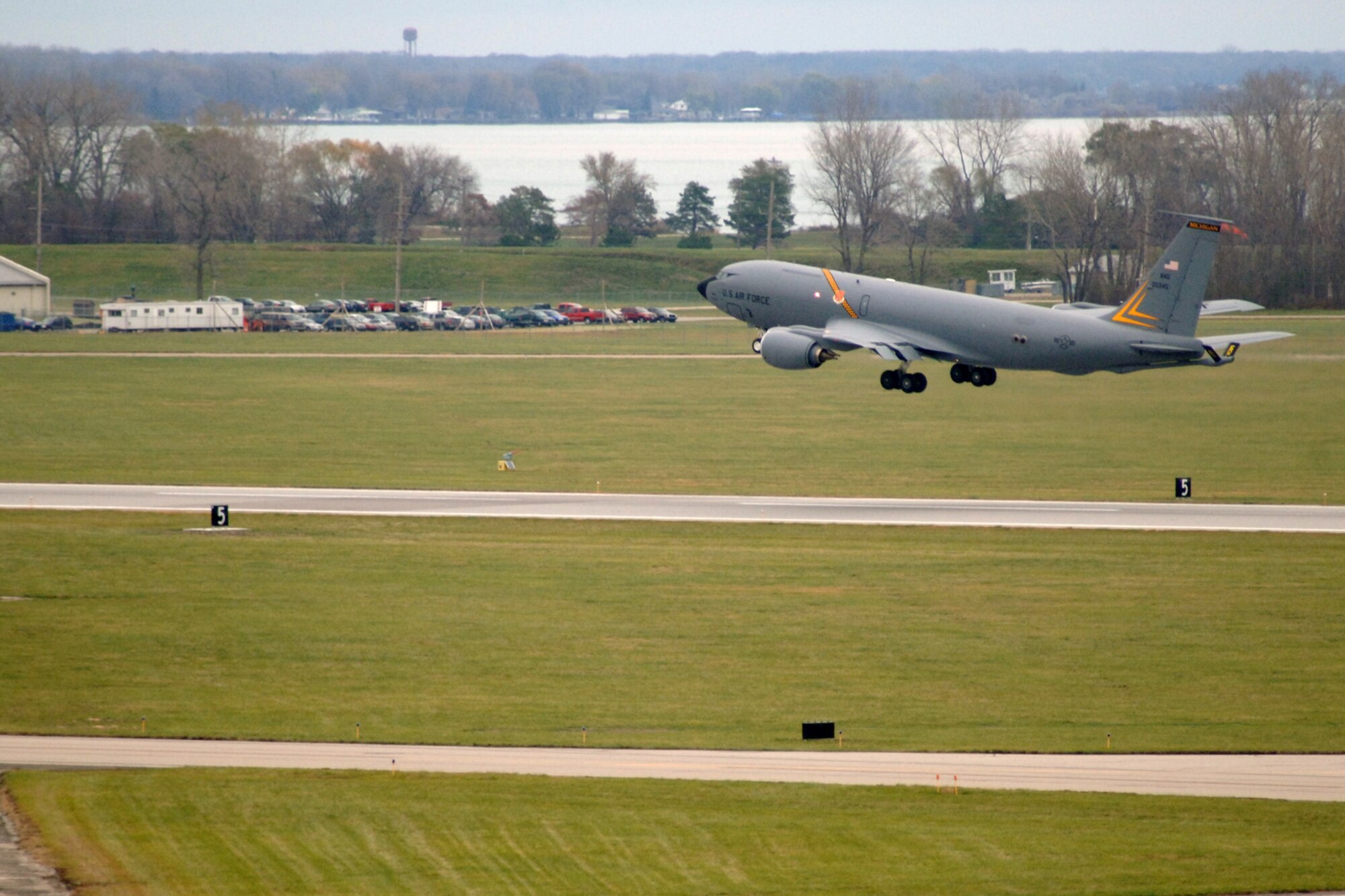 Known as the “Commander’s Plane” due to the distinctive yellow markings, a KC-135 Stratotanker lifts off at Selfridge Air National Guard Base, Mich., Nov. 4, 2012. The KC-135 is flown by the 171st Air Refueling Squadron and maintained by the 191st Maintenance Squadron and 191st Aircraft Maintenance Squadron. The striping on the mid-section of the aircraft features the black and yellow checkerboard design that has been marking aircraft of the 191st since the early 1970s, when the unit was flying F-106 Delta Darts and became known as “The Michigan Six-Pack.” The styling of the stripe also recalls the heritage of the former Strategic Air Command of the U.S. Air Force, units of which were assigned to Selfridge in the 1950s and ‘60s. (Air National Guard photo by John S. Swanson)