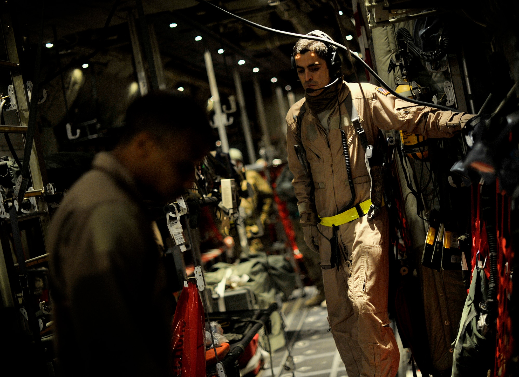 U.S. Air Force aircrew members with the 651st Expeditionary Aeromedical Evacuation  Squadron prepare a C-130 Hercules for an aeromedical evacuation flight at Kandahar Airfield, Afghanistan, Oct. 21, 2012. The aeromedical flights are used to transport injured or recovered patients with the NATO Role 3 hospital and the Contingency Aeromedical Staging Facility. The CASF staff at Kandahar is 28 members strong and performs tasks ranging from helping medevac patients off helicopters to providing warm beds for their outgoing temporary residents. (U.S. Air Force photo/Staff Sgt. Clay Lancaster)