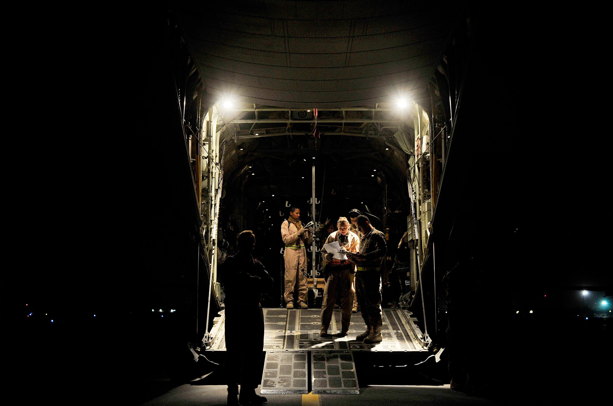 U.S. Air Force aircrew members with the 651st Expeditionary Aeromedical Evacuation  Squadron prepare a C-130 Hercules for an aeromedical evacuation flight at Kandahar Airfield, Afghanistan, Oct. 21, 2012. The aeromedical flights are used to transport injured or recovered patients with the NATO Role 3 hospital and the Contingency Aeromedical Staging Facility. The CASF staff at Kandahar is 28 members strong and performs tasks ranging from helping medevac patients off helicopters to providing warm beds for their outgoing temporary residents. (U.S. Air Force photo/Staff Sgt. Clay Lancaster)