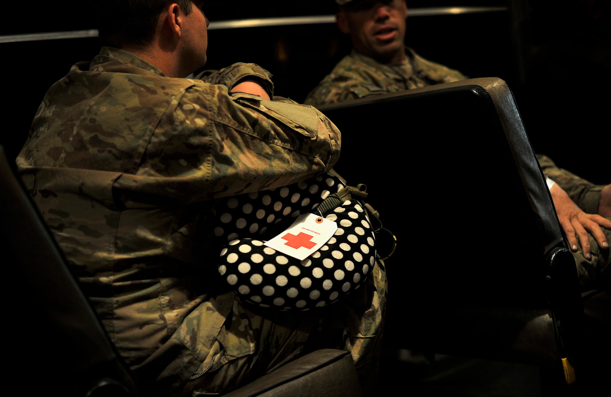 U.S. Army soldiers talk while they are transported out to a C-130 Hercules before an aeromedical flight from Kandahar Airfield, Afghanistan, Oct. 21, 2012. These patients were part of the Contingency Aeromedical Staging Facility, an Air Force program within the NATO Role 3 hospital that helps prepare patients who were stabilized and cleared for transportation to a higher degree of medical care. The CASF staff at Kandahar is 28 members strong and performs tasks ranging from helping medevac patients off of the helicopters they come in on to providing warm beds for their outgoing temporary residents. (U.S. Air Force photo/Staff Sgt. Clay Lancaster)