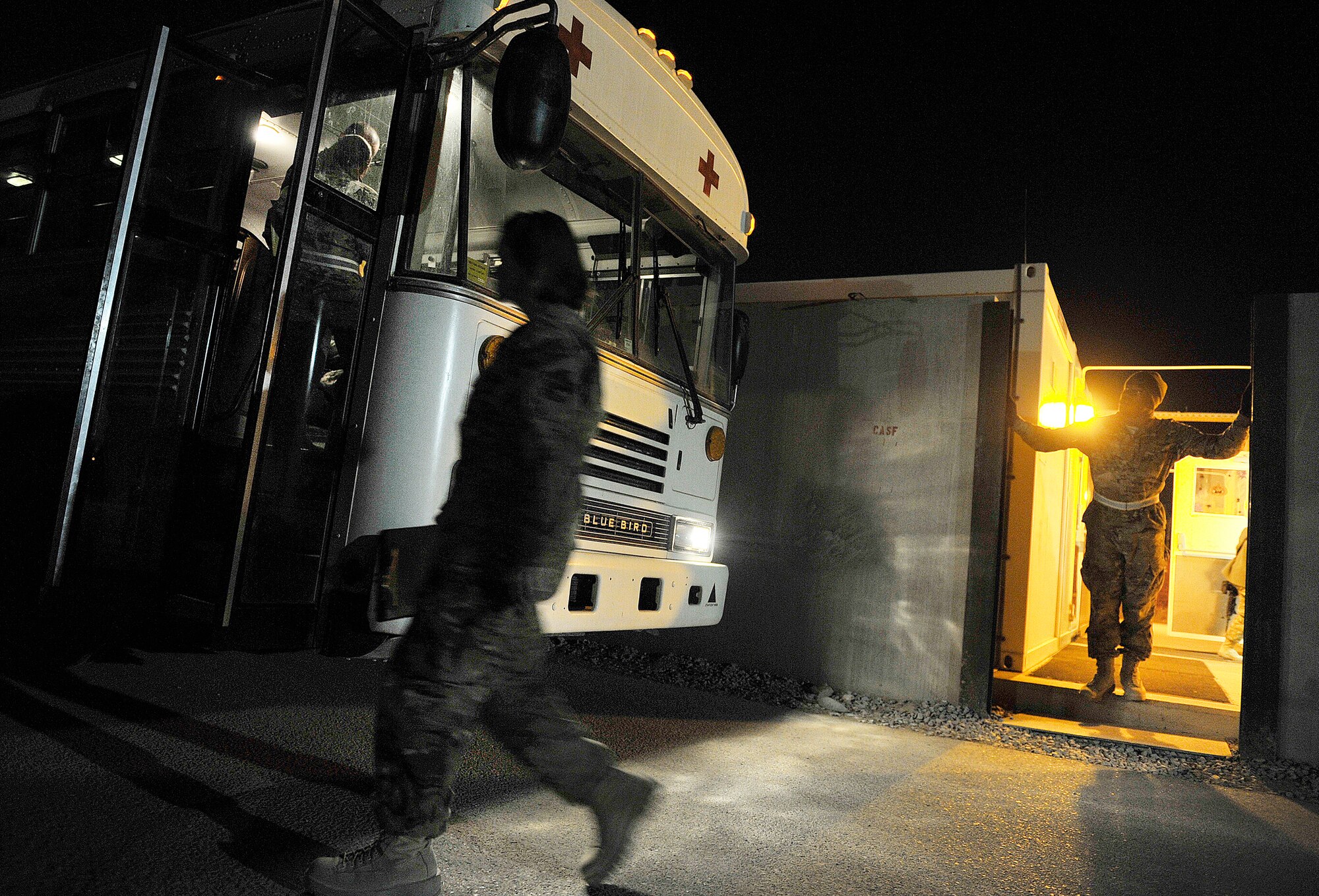 U.S. Air Force Capt. Jennifer Rhoades, Contingency Aeromedical Staging Facility senior nurse, 651st Expeditionary Aeromedical Evacuation Squadron, departs the CASF compound after preparing eight aeromedical patients for a short flight from Kandahar Airfield, Afghanistan, Oct. 21, 2012. Rhoades is deployed from Keesler AFB, Miss. The CASF staff at Kandahar is 28 members strong and performs tasks ranging from helping medevac patients off of the helicopters to providing warm beds for their outgoing temporary residents. (U.S. Air Force photo/Staff Sgt. Clay Lancaster)