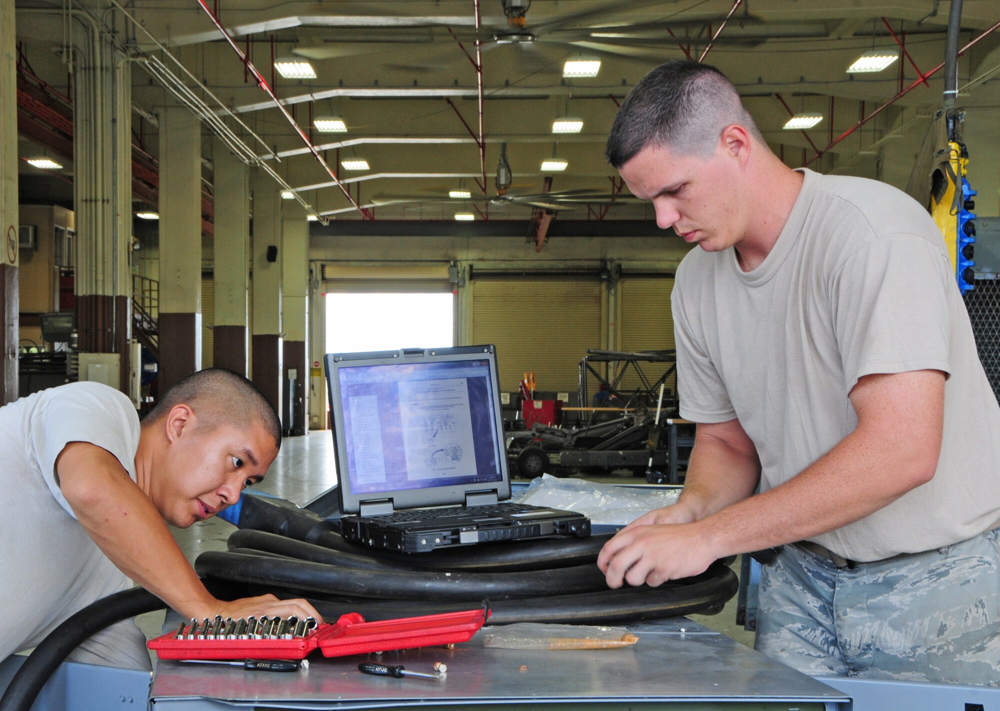 ANDERSEN AIR FORCE BASE, Guam – Staff Sgt. Ronn Angelo Itugot (left) and Staff Sgt. Christopher Twiggs, 36th Maintenance Squadron aerospace ground equipment flight craftsmen, perform maintenance on a power generator at Andersen Air Force Base, Guam, Oct. 30. Aircraft maintenance units use AGE equipment to conduct maintenance work on the aircraft and run systems on the aircraft when it’s parked on the flightline. (U.S. Air Force photo/Airman 1st Class Marianique Santos/Released)