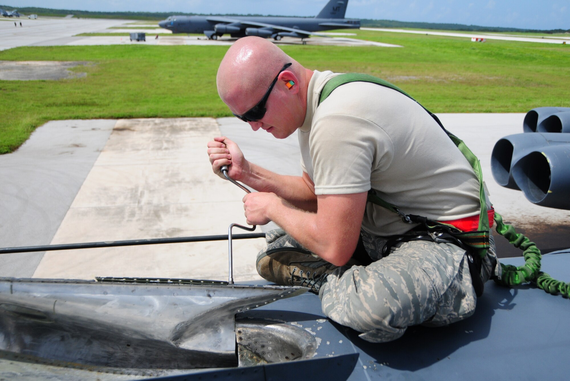 ANDERSEN AIR FORCE BASE, Guam – Staff Sgt. Joshua Engle, 96th Expeditionary Aircraft Maintenance Unit dedicated crew chief, turns screws of an in-flight refueling light on a B-52 Stratofortress here, Oct. 24. Sergeant Engle is deployed to Andersen Air Force Base from Barksdale Air Force Base, La. (U.S. Air Force photo/Airman 1st Class Marianique Santos/Released)