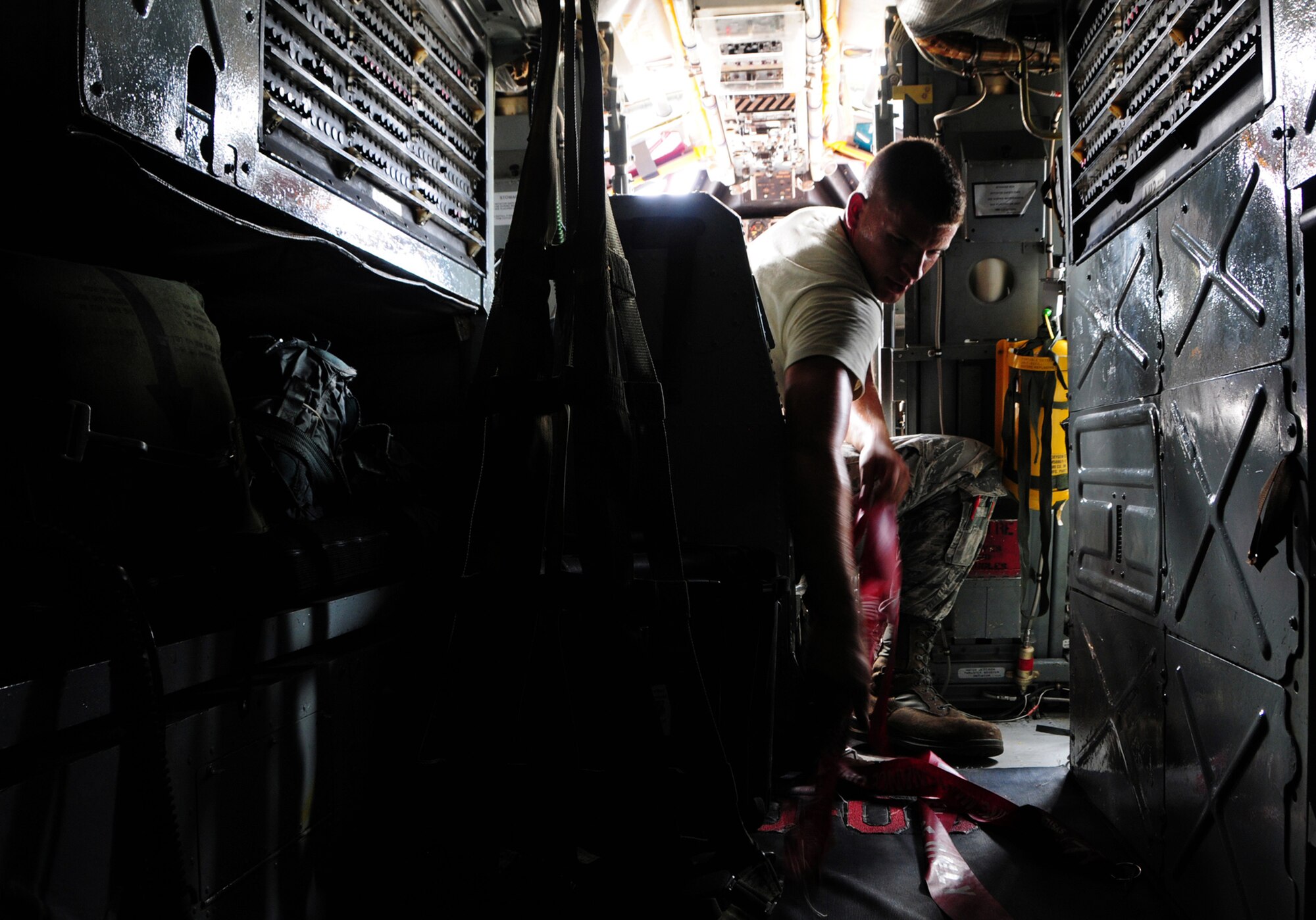ANDERSEN AIR FORCE BASE, Guam -- Airman 1st Class Benjamin Deachin, 96th Expeditionary Aircraft Maintenance Unit dedicated crew chief, removes the ejection seat safety pins during a routine maintenance inspection of a B-52 Stratofortress here, Oct. 24. Airman Deachin is deployed to Andersen Air Force Base from Barksdale Air Force Base, La. (U.S. Air Force photo/Airman 1st Class Marianique Santos/Released)
