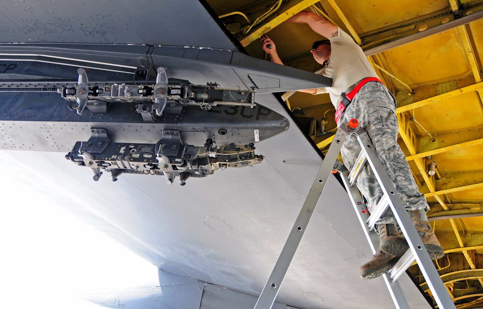 ANDERSEN AIR FORCE BASE, Guam -- Airman 1st Class Benjamin Deachin, 96th Expeditionary Aircraft Maintenance Unit dedicated crew chief, services a hydraulic reservoir on a B-52 Stratofortress here, Oct. 24. Airman Deachin is deployed to Andersen Air Force Base from Barksdale Air Force Base, La. (U.S. Air Force photo/Airman 1st Class Marianique Santos/Released)