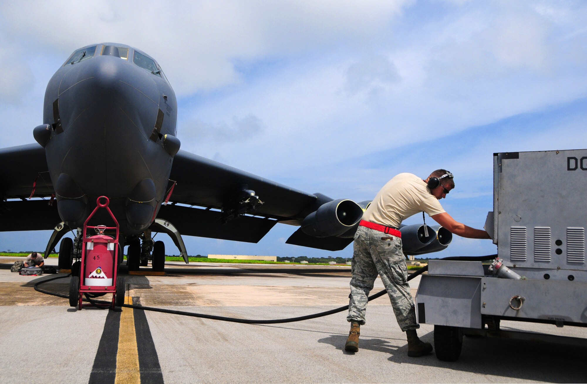 ANDERSEN AIR FORCE BASE, Guam -- Airman 1st Class Benjamin Deachin, 96th Expeditionary Aircraft Maintenance Unit dedicated crew chief, turns on the external power source while conducting standard maintenance procedures for a B-52 Stratofortress here, Oct. 24. Airman Deachin is deployed to Andersen Air Force Base from Barksdale Air Force Base, La. (U.S. Air Force photo/Airman 1st Class Marianique Santos/Released)