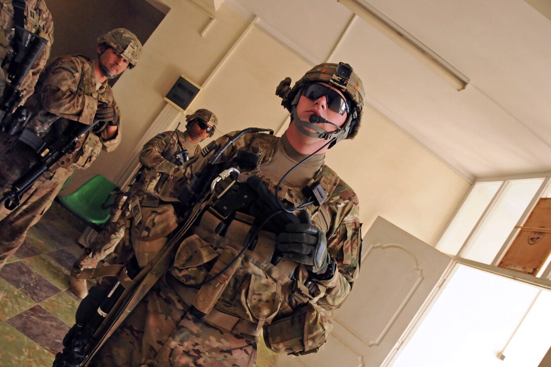 U.S. Army Spc. David White pulls security during a graduation ceremony for local Afghan interns who completed the RAMP UP program in support of education, governance and capacity building in Farah City, Afghanistan, Nov. 4, 2012. White is assigned to Provincial Reconstruction Team Farah.