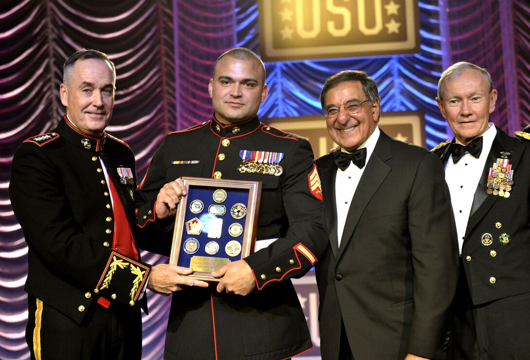 Marine Corps Gen. Joseph Dunford, left, assistant Marine Corps commandant, Defense Secretary Leon E. Panetta, right, and Army Gen. Martin E. Dempsey, chairman of the Joint Chiefs of Staff, far right, present the USO Marine of the Year award to Marine Corps Sgt. Clifford M. Wooldridge, center, during the 2012 USO Gala held at the Washington Hilton in Washington, D.C., Nov. 2, 2012.