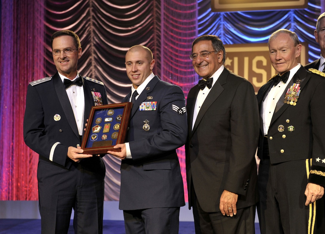 Air Force Lt. Gen. Joseph L. Lengyel, left, vice chief of the National Guard Bureau, Defense Secretary Leon E. Panetta, center, and Army Gen. Martin E. Dempsey, right, chairman of the Joint Chiefs of Staff, present the USO National Guardsman of the Year award to Senior Airman Evan J. Stevens, second from left, during the 2012 USO Gala at the Washington Hilton in Washington, D.C., Nov. 2, 2012.
