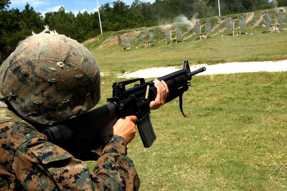 A shell ejects out of the rifle of Rct. Tarah Williams of Platoon 4019, November Company, 4th Recruit Training Battalion, as she fires during her Table 2 prequalification on June 21, 2012 at Parris Island's Hue City range. Williams and her fellow recruits are scheduled to graduate July 13, 2012.
