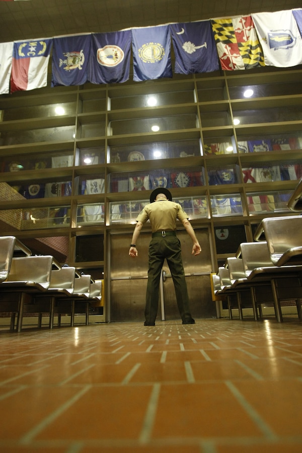 Drill Instructor Sgt. James Case, a 28-year-old from Jackson, Mich., prepares to welcome Delta Company, 1st Recruit Training Battalion's newest recruits through the doors at Parris Island July 16, 2012. The recruits are lined up in two columns on the other side of the doors, getting their introductory brief of the Island. Delta Company graduated Oct. 5, 2012.
