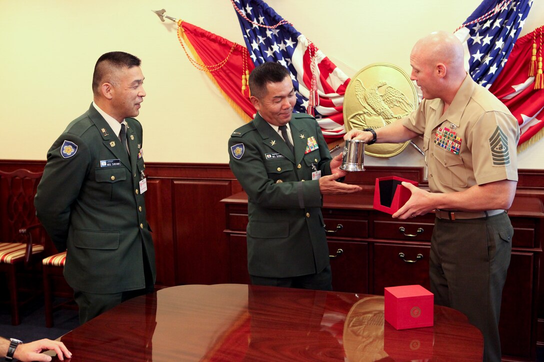 Sgt. Maj. Micheal P. Barrett, the 17th Sergeant Major of the Marine Corps, visits with Warrant Officer Shimizu Ichiro, the Sergeant Major of the Japanese Ground Self Defense Force, in the Pentagon, Washington, D.C. Oct. 24, 2012. (U.S. Marine Corps photo by Cpl. Cody A. Fodale)