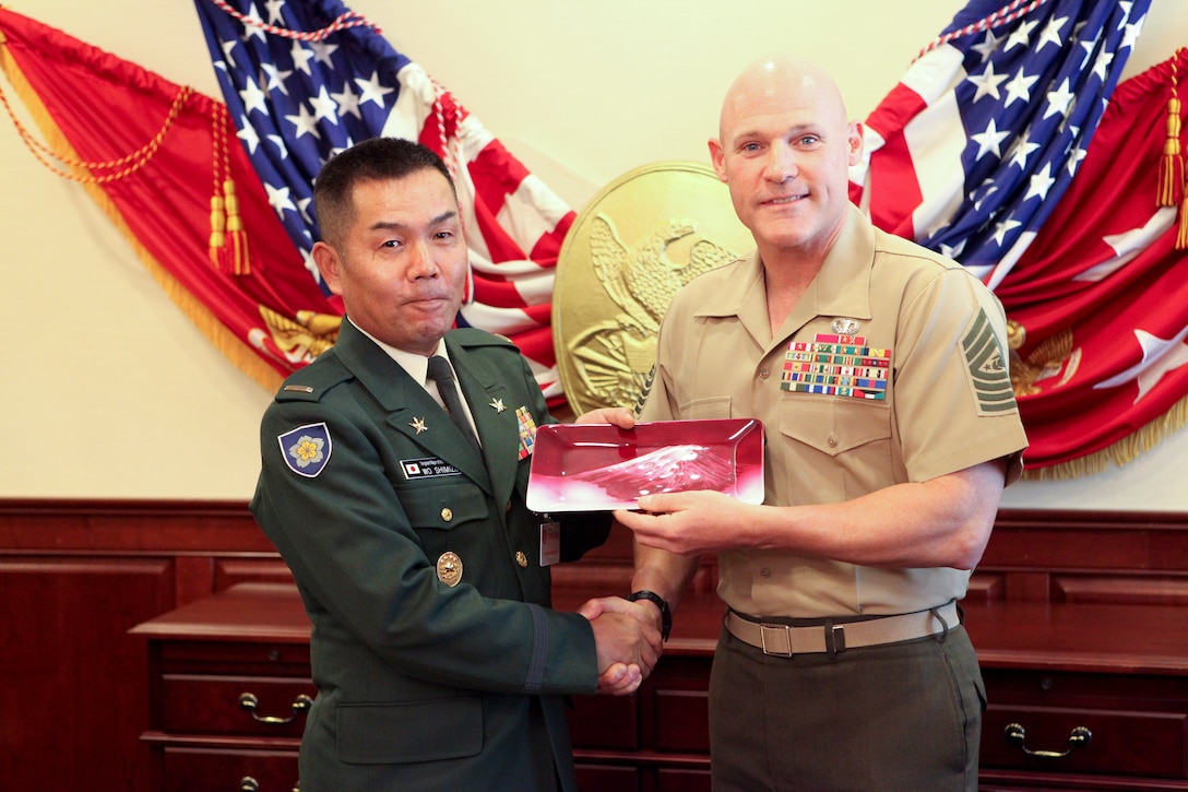 Sgt. Maj. Micheal P. Barrett, the 17th Sergeant Major of the Marine Corps, visits with Warrant Officer Shimizu Ichiro, the Sergeant Major of the Japanese Ground Self Defense Force, in the Pentagon, Washington, D.C. Oct. 24, 2012. (U.S. Marine Corps photo by Cpl. Cody A. Fodale)