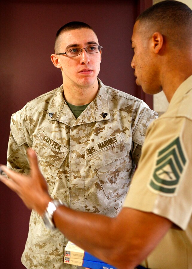 Cpl. Ryan Costea, a rifleman with Company D, Anti-Terrorism Battalion, 4th Marine Division, listens as Gunnery Sgt. Patrick Foreman, a career planner, explains Costea’s available choices to him in Billings, Mont., Oct. 20, 2012. 