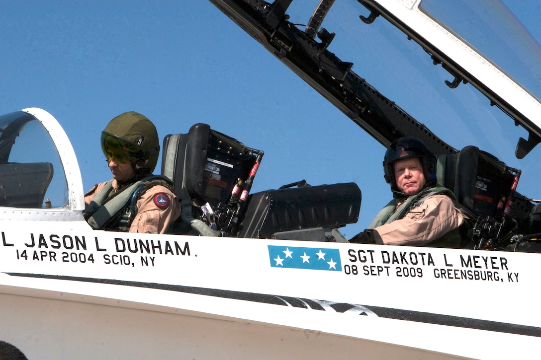 Gen. James F. Amos, the commandant of the Marine Corps, and Lt. Col. Robert B. Brodie, the commanding officer of Marine Fighter Attack Squadron 101, prepare to fly in an F/A-18 Hornet dedicated by Marine Fighter Attack Training Squadron 101 to recent Medal of Honor recipients during a ceremony aboard Marine Corps Air Station Miramar, Calif., Nov. 2. VMFAT-101 specially painted the aircraft with the names of recent Medal of Honor recipients, Cpl. Jason L. Dunham, a Scio, N.Y., native, Sgt. Dakota Meyer, a Greensburg, Ken., native, Petty Officer 2nd Class Michael A. Monsoor, a Long Beach, Calif., native and Navy Lt. Michael P. Murphy, a Smithtown, N.Y., native.