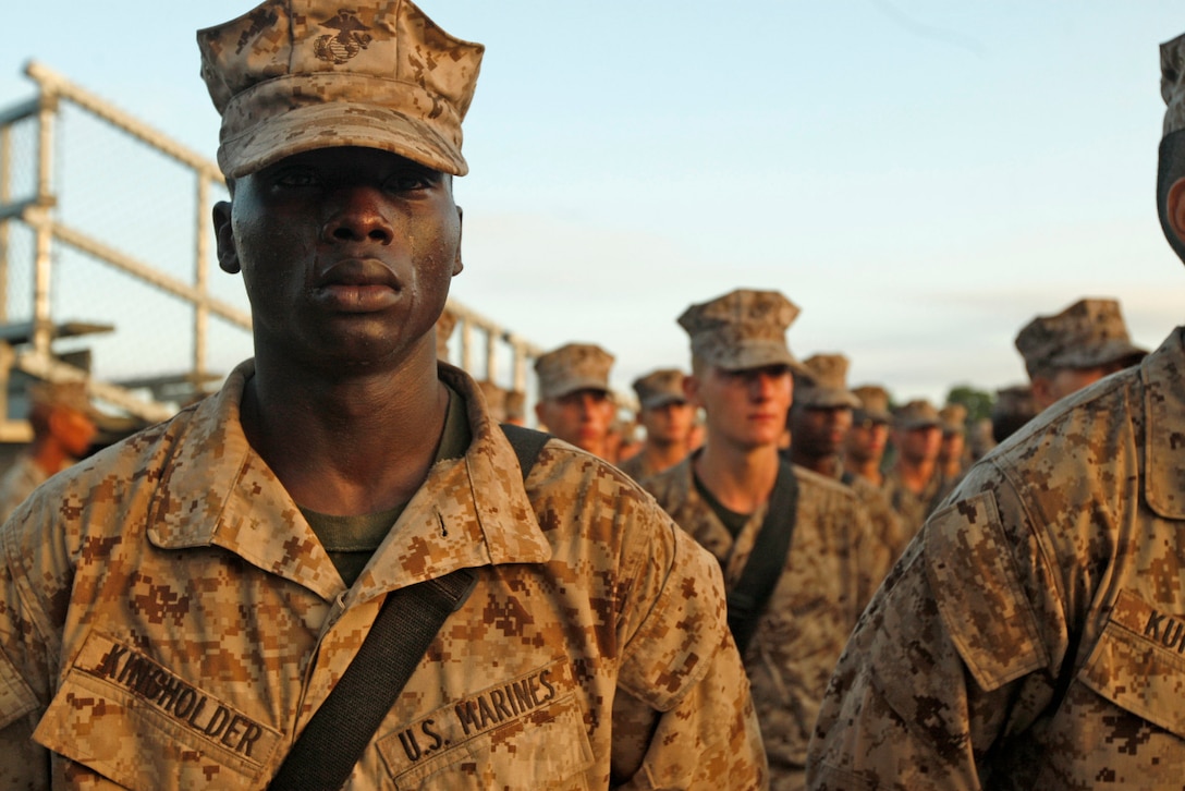 Tears stream down the face of 19-year-old Rct. Quadir King-Holder, of Platoon 3065, Kilo Company, 3rd Recruit Training Battalion, during the Eagle, Globe and Anchor Ceremony at the Iwo Jima flag raising statue on Parris Island, S.C., on Sept. 1, 2012. The recruits receive their emblems after completing the 54-hour Crucible. Kilo Company graduated Sept. 7, 2012. 