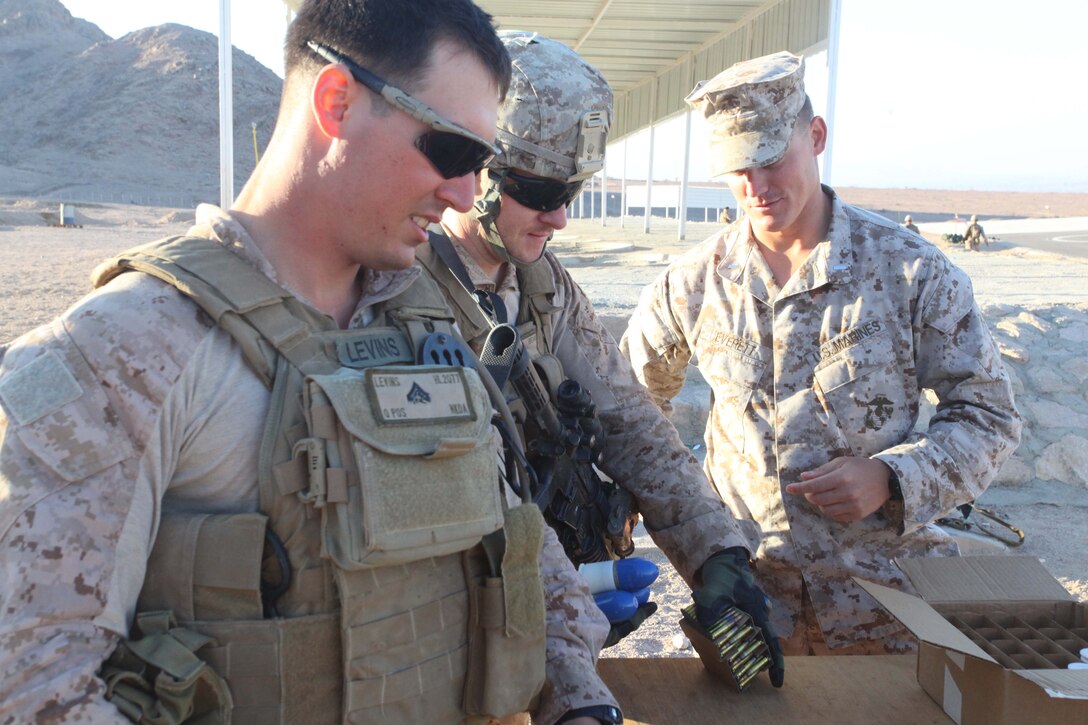 JORDAN (Oct. 11, 2012)  U.S. Marines assigned to Marine Engagement Team from Battalion Landing Team 1st Battalion, 2nd Marine Regiment, 24th Marine Expeditionary Unit, prepare to hand out ammunition prior to conducting a live fire training exercise, Oct. 11, 2012. The engagement team is a platoon-sized group of Marines from the 24th MEU who are conducting a variety of unilateral and bilateral training events with the Jordanian Marines in southern Jordan. The 24th MEU is deployed with the Iwo Jima Amphibious Ready Group as a U.S. Central Command theater reserve force, providing support for maritime security operations and theater security cooperation efforts in the U.S. 5th Fleet area of responsibility. (U.S. Marine Corps photo by Lance Cpl. Tucker S. Wolf/Released) 