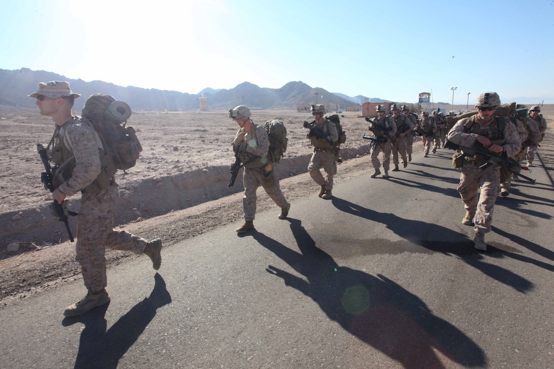 JORDAN (Oct. 9, 2012) U.S. Marines assigned to Marine Engagement Team from Battalion Landing Team 1st Battalion, 2nd Marine Regiment, 24th Marine Expeditionary Unit, conduct a hike while participating in a training exercise in Jordan, Oct. 9, 2012. The engagement team is a platoon-sized group of Marines from the 24th MEU who are conducting a variety of unilateral and bilateral training events with the Jordanian Marines in southern Jordan. The 24th MEU is deployed with the Iwo Jima Amphibious Ready Group as a U.S. Central Command theater reserve force, providing support for maritime security operations and theater security cooperation efforts in the U.S. 5th Fleet area of responsibility. (U.S. Marine Corps photo by Lance Cpl. Tucker S. Wolf/Released)