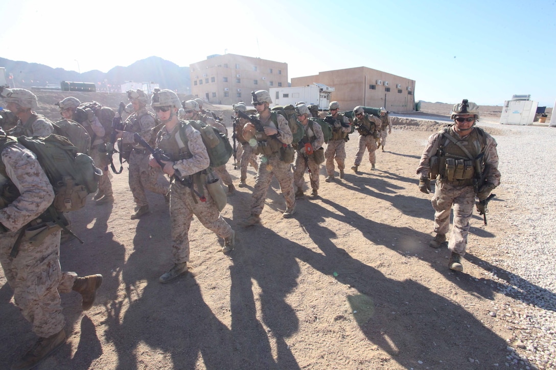 JORDAN (Oct. 9, 2012) U.S. Marines assigned to Marine Engagement Team from Battalion Landing Team 1st Battalion, 2nd Marine Regiment, 24th Marine Expeditionary Unit, conduct a hike while participating in a training exercise in Jordan, Oct. 9, 2012. The engagement team is a platoon-sized group of Marines from the 24th MEU who are conducting a variety of unilateral and bilateral training events with the Jordanian Marines in southern Jordan. The 24th MEU is deployed with the Iwo Jima Amphibious Ready Group as a U.S. Central Command theater reserve force, providing support for maritime security operations and theater security cooperation efforts in the U.S. 5th Fleet area of responsibility. (U.S. Marine Corps photo by Lance Cpl. Tucker S. Wolf/Released)