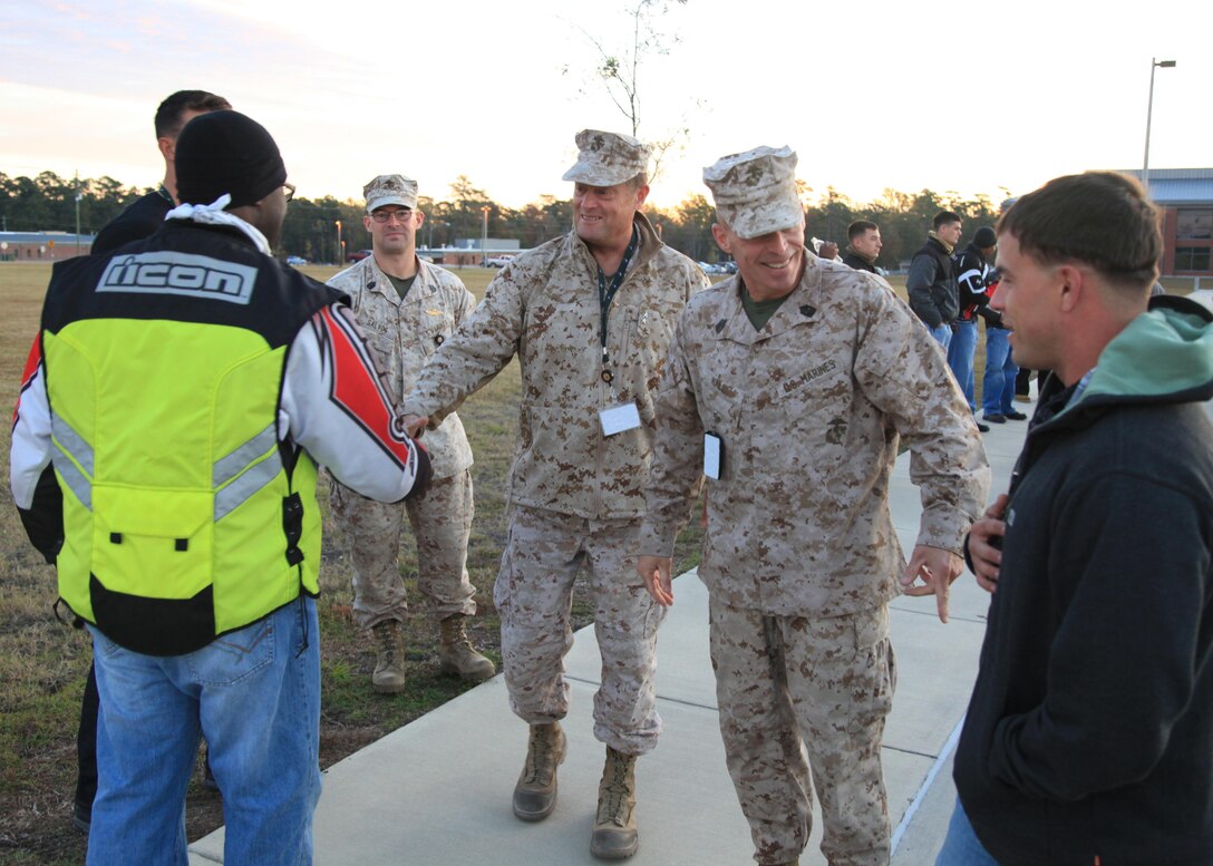 Major General Mark A. Clark, commander of U.S. Marine Corps Forces, Special Operations Command, and Sgt. Maj. Thomas F. Hall, MARSOC sergeant major, greet MARSOC motorcycle operators before they embark on an outing Oct. 31, 2012 aboard Camp Lejeune, NC. The occasion marked the first time MARSOC's various motorcycle clubs assembled for a consolidated ride. "First and foremost, this outing was about safety," said Master Gunnery Sgt. George Lee, a rider with 15 years' experience. "It was also about camaraderie and mentorship." The riders drove to Wilmington for a tour of the USS North Carolina and to explore local hobby shops. Experience among the motorcyclists ranged from three months to upwards of 30 years. "It was definitely a worthwhile experience," said Lance Cpl. Roderick Kim, a small craft mechanic at MARSOC who is new to riding. "I learned how to ride with a group, learned how to space myself. It was good training."
