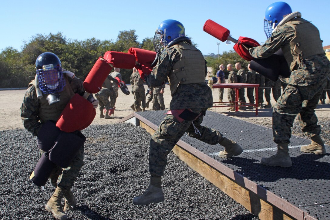three recruits of Company I, 3rd Recruit Training Battalion, fight against one another in a pugil stick bout aboard Marine Corps Recruit Depot San Diego, Oct. 28. Recruits were faced with different scenarious such as three-way fight and three versus one. 