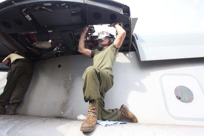 USS IWO JIMA (Nov. 5, 2012) - A Marine with Marine Medium Tiltrotor Squadron 261 (Reinforced), 24th Marine Expeditionary Unit, conducts engine maintenance on an MV-22B Osprey while transiting through the Suez Canal aboard the USS Iwo Jima, Nov. 5, 2012. The 24th MEU is deployed with the Iwo Jima Amphibious Ready Group and is currently in the 6th Fleet Area of Responsibility as a disaster relief and crisis response force. Since deploying in March, they have supported a variety of missions in the U.S. Central and European Commands, assisted the Navy in safeguarding sea lanes, and conducted various bilateral and unilateral training events in several countries in the Middle East and Africa. The 24th MEU  is scheduled to return to their home bases in North Carolina later this year. (U.S. Marine Corps photo by Lance Cpl. Tucker S. Wolf/Released)