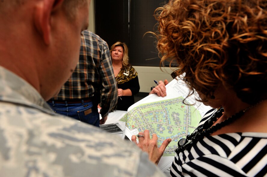 Jamie Miller, General Manager, Southern Group, Forest City Military Community assists Senior Airman Corey Thomas, Disbursing Technician, Finance Section, Air Force Central Command, Shaw Air Force Base, S.C., in understanding the phasing process and helping him determine a date for when he and his family are due to move into newer housing Oct. 30, 2012, Shaw AFB, S.C. (U.S. Air Force photo by Staff Sgt. Ave I. Young/Released)
