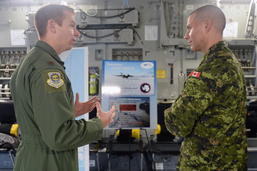 Maj. Matthew Armstrong, 62nd Operations Group executive officer, talks about the 62nd Airlift Wing's Operation Deep Freeze mission to Canadian Army Brig. Gen. Jean-Marc Lanthier, I Corps deputy commanding general of sustainment, Oct. 30, 2012 at Joint Base Lewis-McChord, Wash. Lanthier visited the 62nd AW to understand training and operational capabilities. (U.S. Air Force photo/Staff Sgt. Frances Kriss)