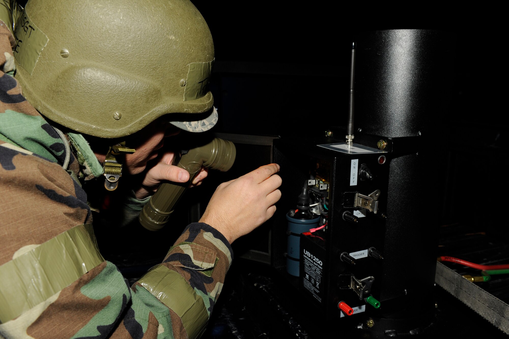 Master Sgt. Todd Cate, 8th Fighter Wing inspector general sets up  equipment for a simulated mortar strike during exercise Beverly Bulldog 13-1 at Kunsan Air Base, Republic of Korea, Nov. 6, 2012. The new device allows the Exercise Evaluation Team to simulate mortars, missile attacks, and smoke. (U.S. Air Force photo/Senior Airman Marcus Morris)