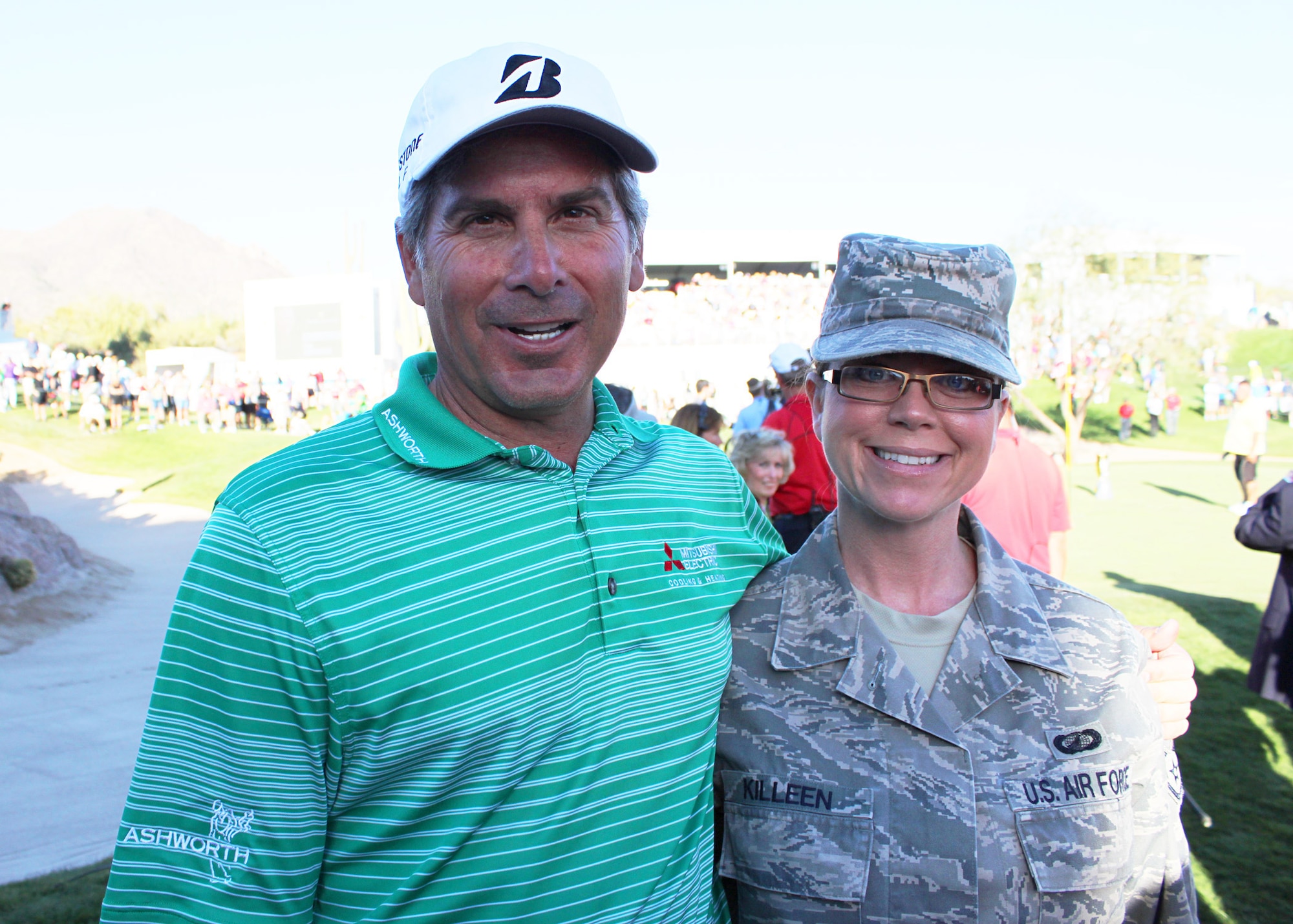 Golf professional, Fred Couples closed the Charles Schwab Cup Championship with one of his biggest fans, Staff Sgt. Teresa Killeen, Contracting Specialist, 944th Fighter Wing, Luke Air Force Base, Ariz.  (U.S. Air Force Photo by Tech. Sgt. Meredith Mingledorff)
 