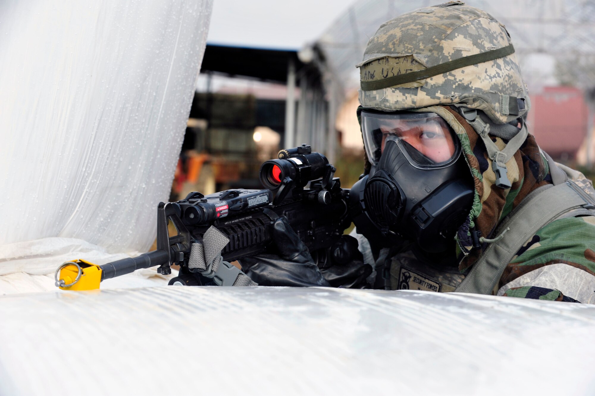 A defender with the 51st Security Forces Squadron provides security during a simulated ground attack as part of operational readiness exercise Beverly Bulldog 13-01 at Osan Air Base, Republic of Korea, Nov. 6, 2012. Security forces Airmen and Republic of Korea Army 4th Battalion 51st Division soldiers worked together to defend the perimeter of the base. (U.S. Air Force photo/Airman 1st Class Alexis Siekert)