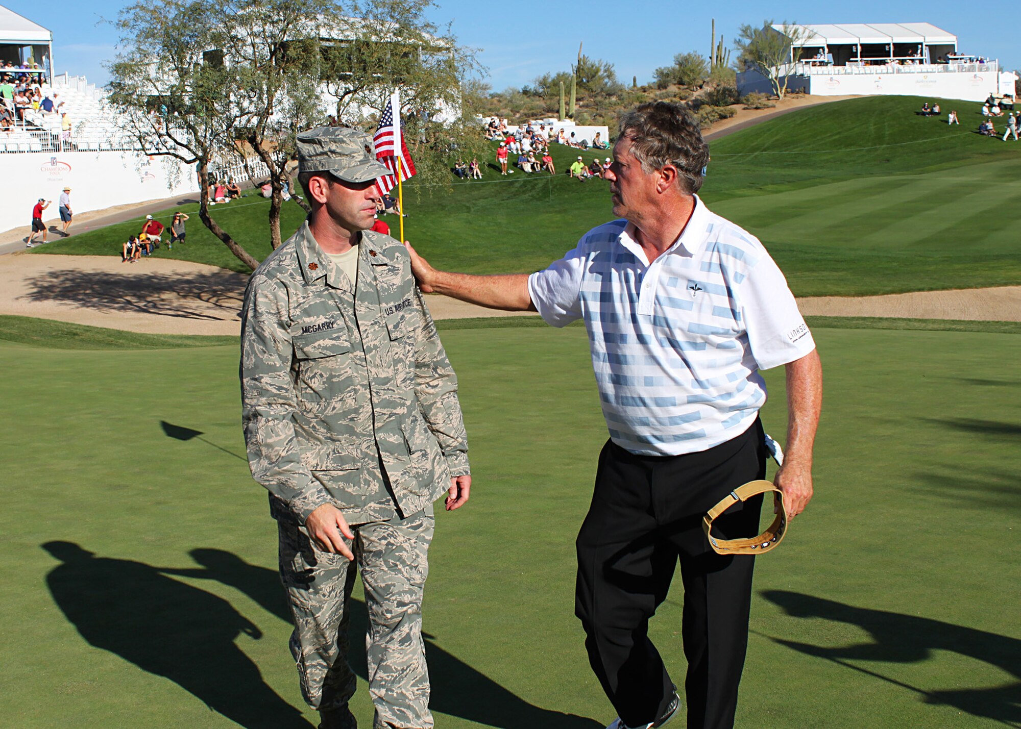 "Thank you for your service," says golf pro Michael Allen to Major William McGarry, Bioenvironmental Equipment Engineer, 944th Aeromedical Staging Squadron during the last day of the Charles Schwab Cup Championship at Desert Mountain Club in Scottsdale, Ariz., Saturday. (U.S. Air Force Photo by Tech. Sgt. Meredith Mingledorff)