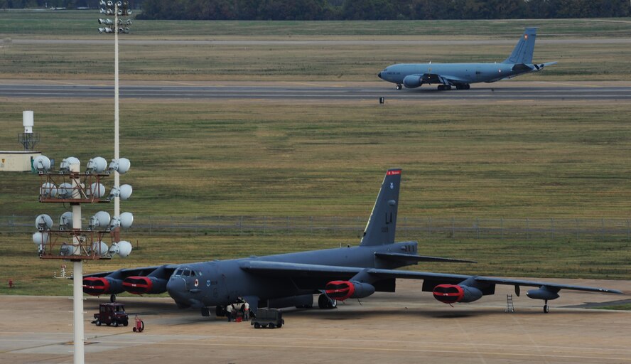 A French KC-135 Stratotanker lands as a B-52H Stratofortress sits on the flightline on Barksdale Air Force Base, La., Nov. 5. The KC-135 landed here as part of the 2012 Air Force Global Strike Challenge. The purpose of the GSC is to showcase the world's premier bomber and intercontinental ballistic missile force, foster esprit de corps through competition and teamwork, recognize outstanding AFGSC personnel and teams and improve combat capabilities through competition and crosstalk. (U.S. Air Force photo/Senior Airman Sean Martin)(RELEASED)