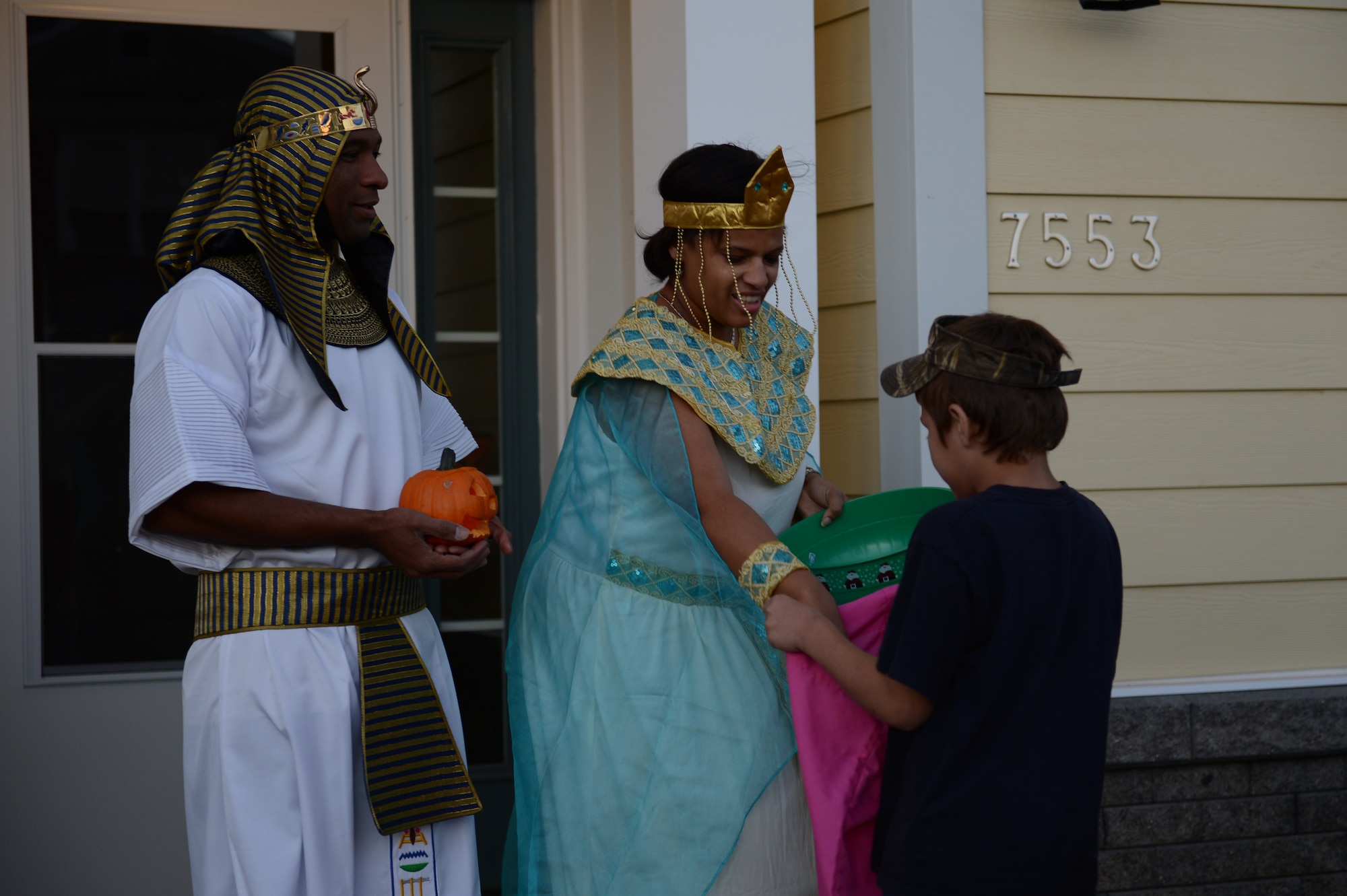 Maj. Chris Fland, 3rd Army/ARCENT chief of exercise and planning, and his wife, Marquitte, a 3rd grade teacher at Shaw Heights Elementary School, dressed up and passed out candy at Shaw Air Force Base, S.C., Oct. 31, 2012. Service members from on and off base gathered at base housing to participate in the base trick or treating. (U.S. Air Force photo by Airman 1st Class Krystal M. Jeffers/Released)