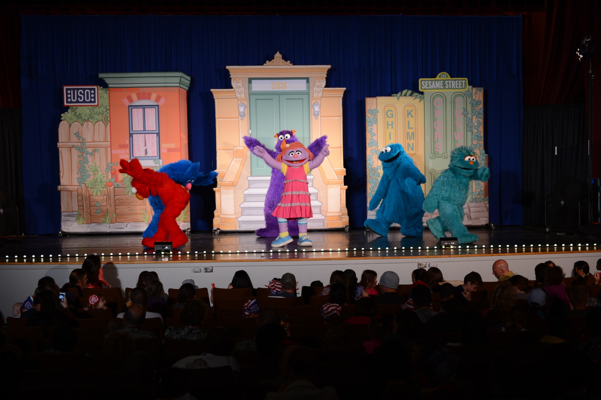 Sesame Street characters dance with their newest friend Katie during a performance at Shaw Air Force Base, S.C., Nov 1, 2012. The show is designed for military children one to six years old. (U.S. Air Force photo by Airman 1st Class Krystal M. Jeffers/Released)