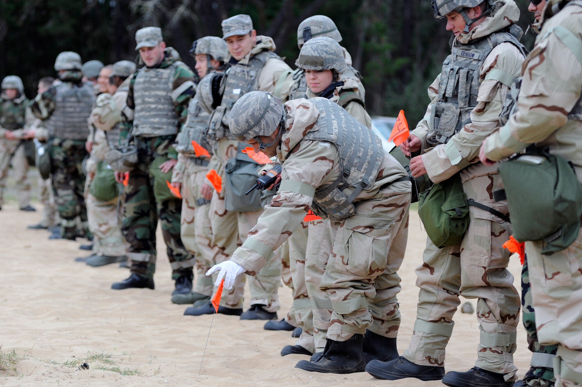 VANDENBERG AIR FORCE BASE, Calif. --
A team of Vandenberg Airmen conduct a sweep to identify and mark unexploded ordnances during deployment readiness training at Cocheo Park Thursday, Nov. 1, 2012. Explosive Ordnance Disposal is one of many essential skills on which Airmen are evaluated as they prepare for deployment. (U.S. Air Force photo/Michael Peterson).