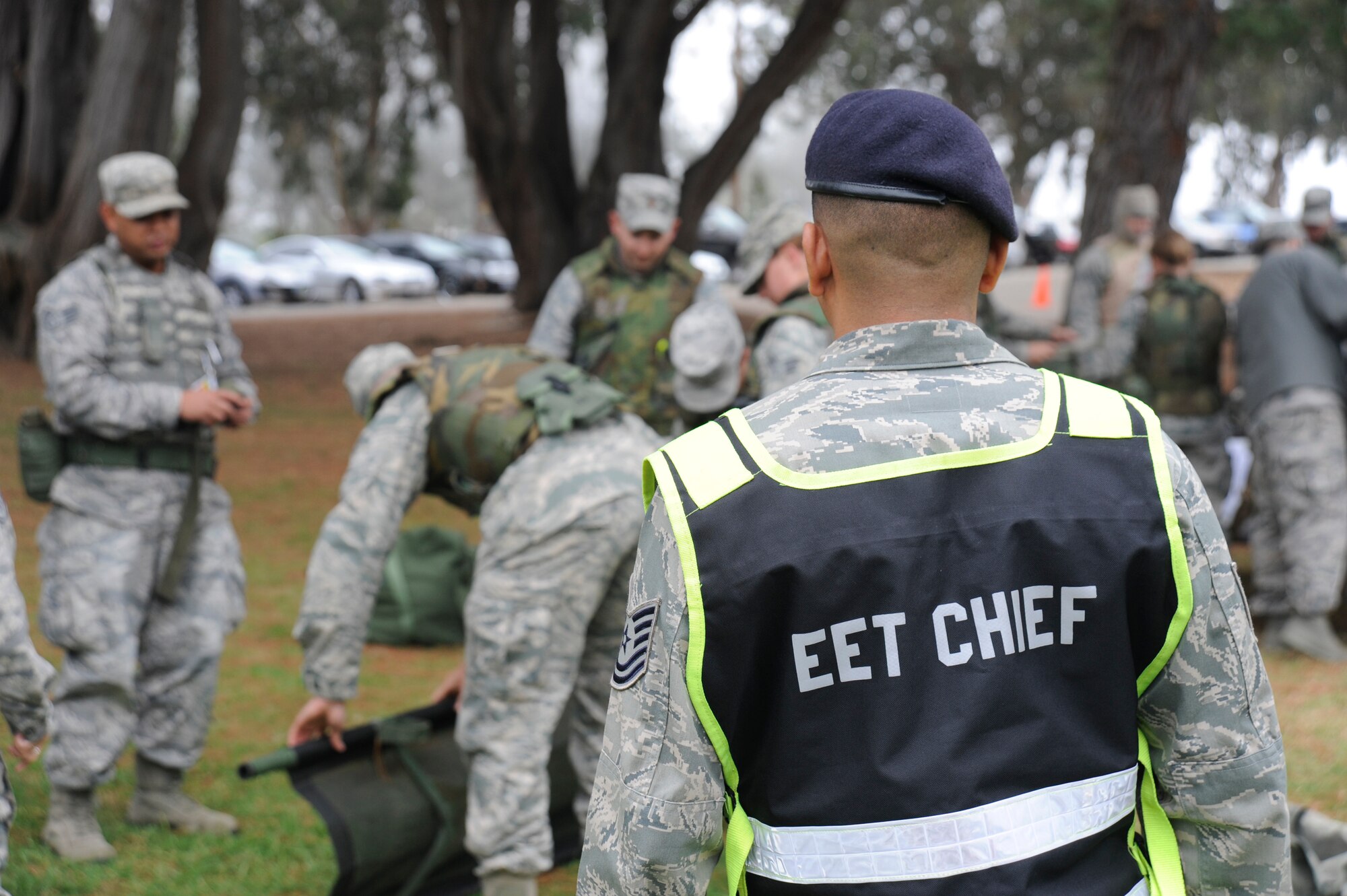 VANDENBERG AIR FORCE BASE, Calif. --
An Exercise Evaluation Team member observes Airmen training at a Self-Aid and Buddy Care station during deployment readiness training at Cocheo Park Thursday, Nov. 1, 2012. EET members provide oversight and feedback to ensure proper training procedures are being followed for deployment readiness. (U.S. Air Force photo/Michael Peterson)